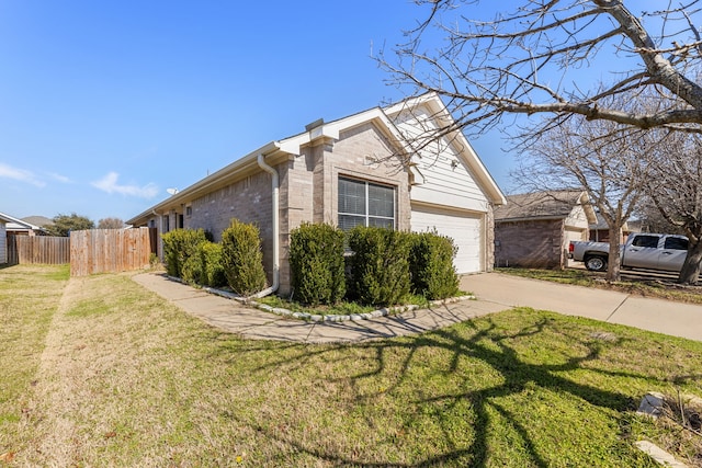 view of property exterior featuring a garage and a lawn