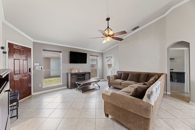 tiled living room featuring ceiling fan, ornamental molding, and high vaulted ceiling