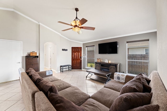 tiled living room featuring high vaulted ceiling, plenty of natural light, crown molding, and ceiling fan