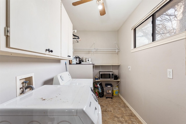 washroom featuring cabinets, ceiling fan, and separate washer and dryer