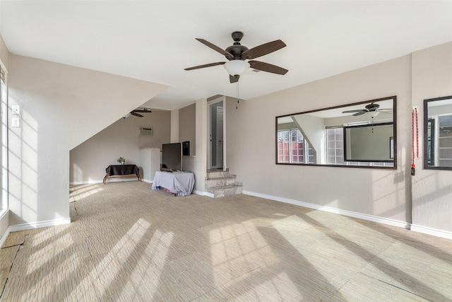 unfurnished living room featuring ceiling fan and carpet floors