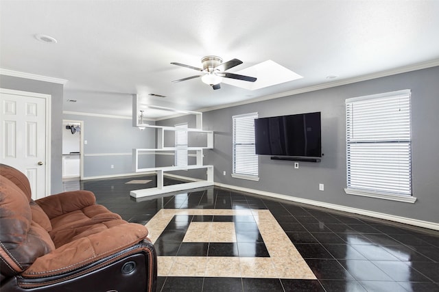 living room featuring ceiling fan, a skylight, and ornamental molding