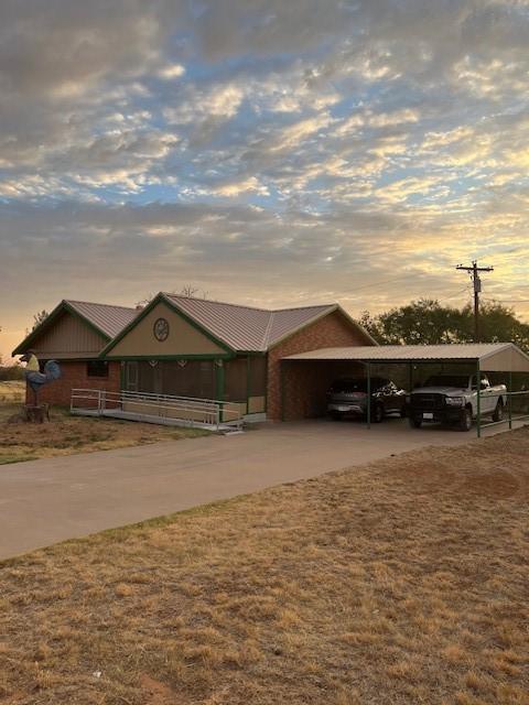 ranch-style house with a carport