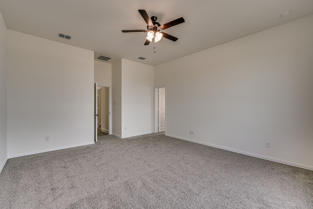 unfurnished room with carpet and ceiling fan