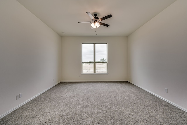 empty room with carpet flooring and ceiling fan