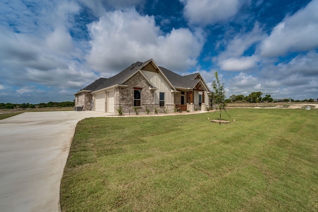 view of front facade with a front yard and a garage