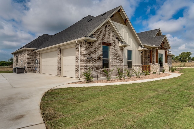 view of property exterior featuring a yard, central AC unit, and a garage