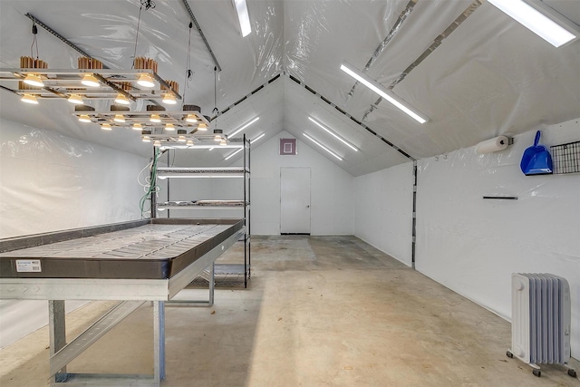 garage featuring radiator heating unit
