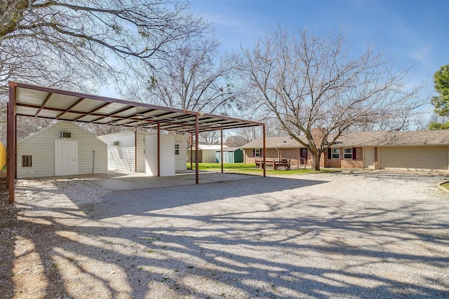 view of vehicle parking with a carport