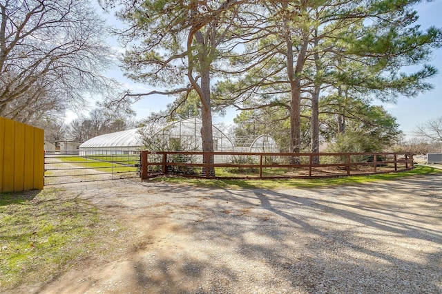 view of gate featuring fence