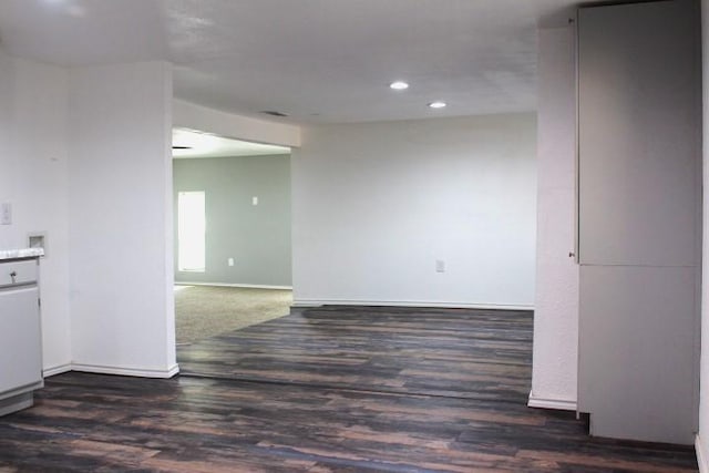 spare room with dark hardwood / wood-style flooring