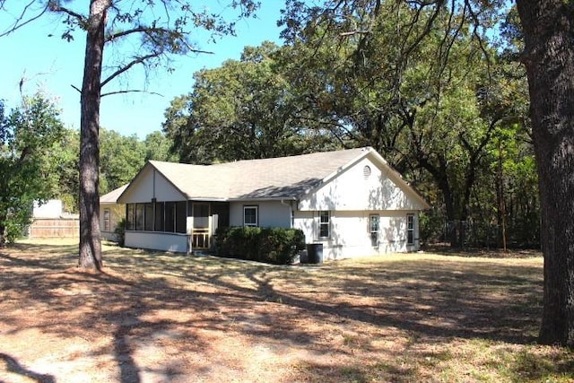 view of home's exterior featuring a sunroom