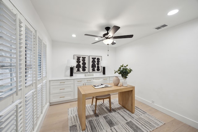 office space with ceiling fan and light hardwood / wood-style flooring