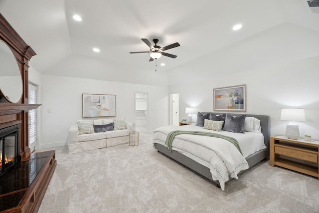 carpeted bedroom with lofted ceiling and ceiling fan