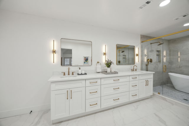 bathroom featuring vanity and independent shower and bath