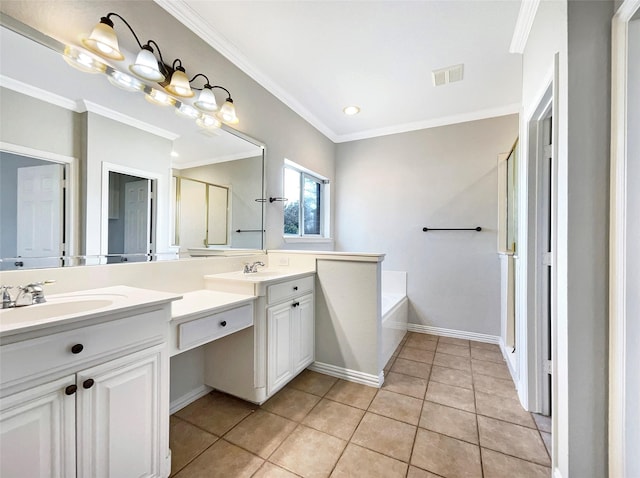 bathroom featuring ornamental molding, a tub, vanity, and tile patterned floors