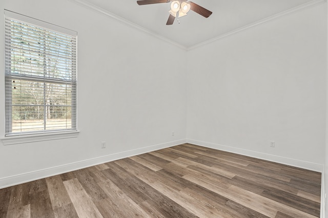 unfurnished room featuring baseboards, ornamental molding, ceiling fan, and wood finished floors