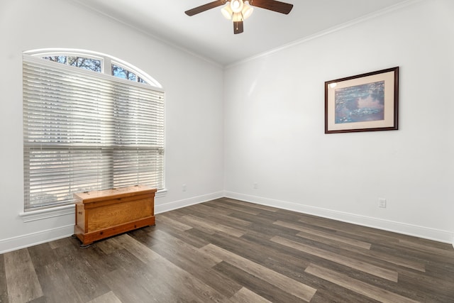 unfurnished room with ornamental molding, baseboards, and dark wood-style floors