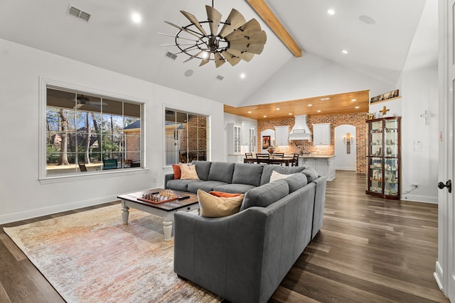 living room with high vaulted ceiling, visible vents, a ceiling fan, beam ceiling, and dark wood finished floors