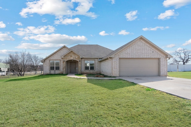 view of front of house featuring a front yard and a garage