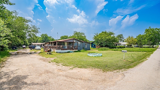 view of front of property with covered porch and a front yard