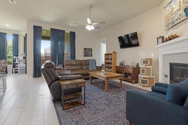 4024 Rosin St, Aubrey, TX 76227 - living area with ceiling fan, recessed lighting, tile patterned flooring, and a fireplace