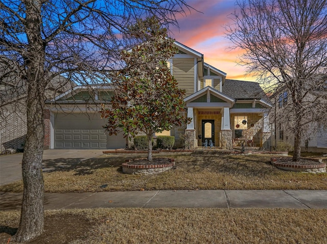 view of front of house with a lawn and a garage