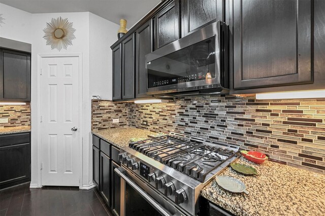 4424 Dashland Dr, Celina, TX 75009 - kitchen featuring appliances with stainless steel finishes, light stone counters, and tasteful backsplash