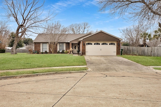 ranch-style home featuring a garage and a front yard