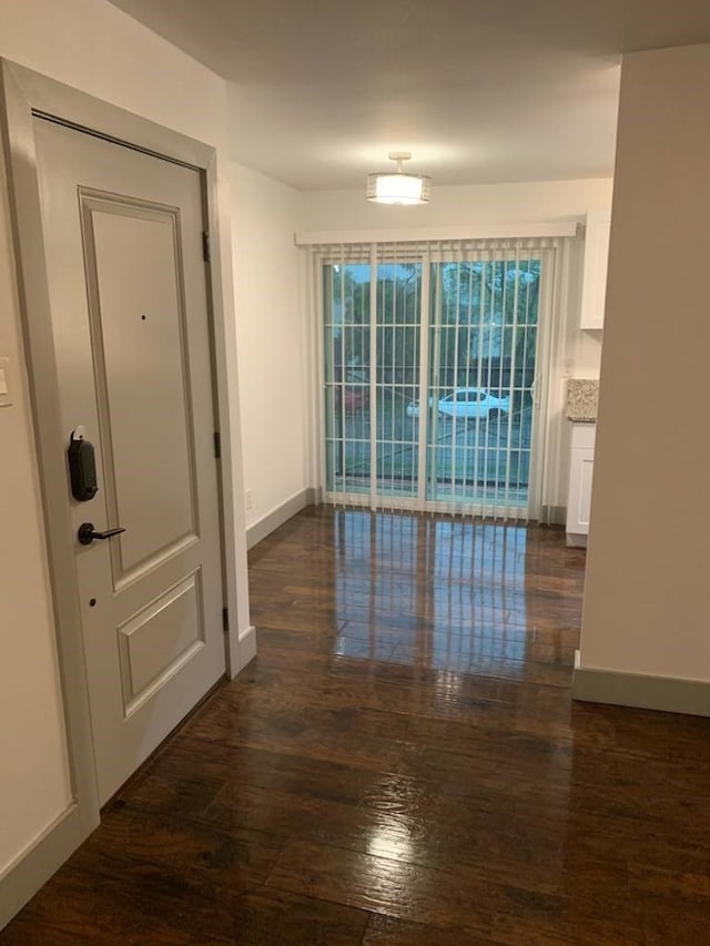 4633 Fairmount St Unit 216, Dallas, TX 75219 - empty room featuring dark wood-type flooring