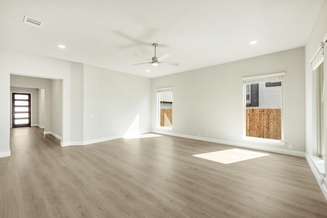 empty room with visible vents, baseboards, a ceiling fan, recessed lighting, and light wood finished floors