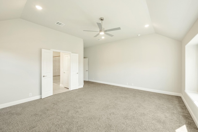 unfurnished bedroom featuring light carpet, visible vents, and lofted ceiling