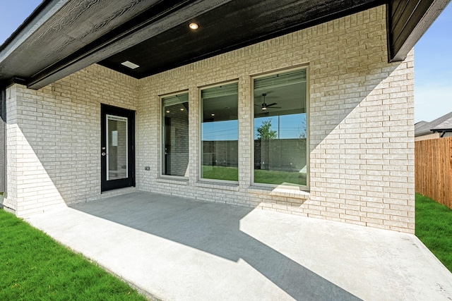 view of patio / terrace featuring fence