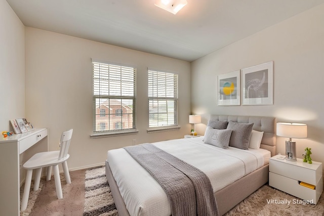 bedroom featuring light colored carpet