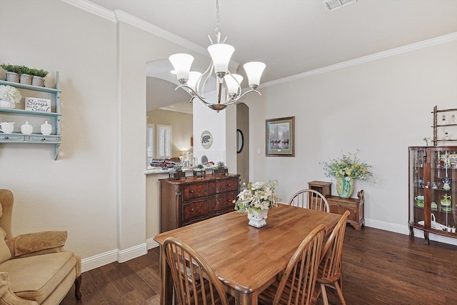 dining area with a notable chandelier, crown molding, arched walkways, and dark wood-style flooring