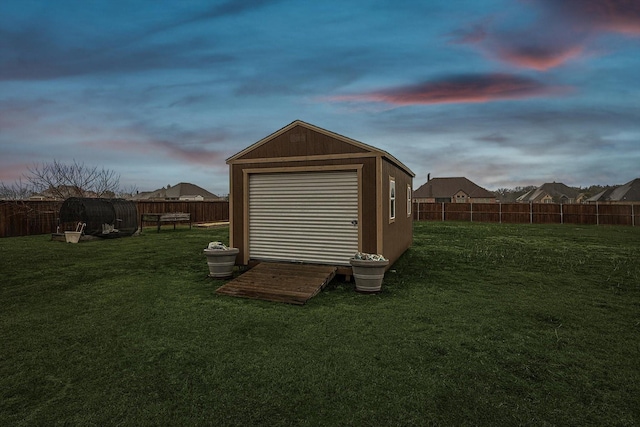 view of shed with a fenced backyard