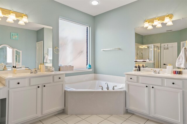 full bath with a walk in closet, visible vents, a shower stall, vanity, and tile patterned flooring