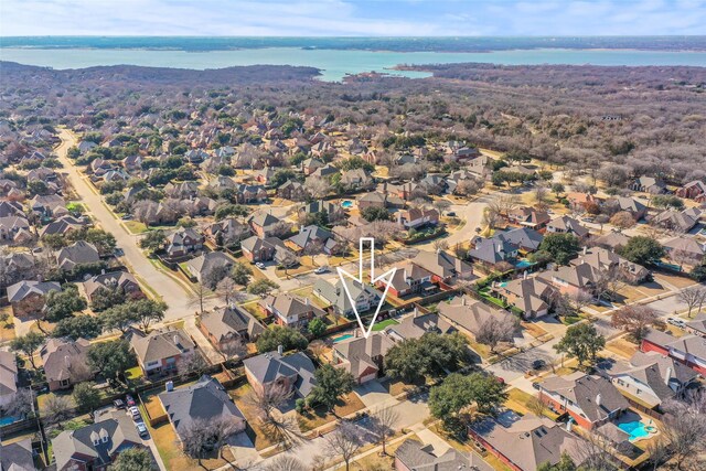 birds eye view of property with a water view and a residential view