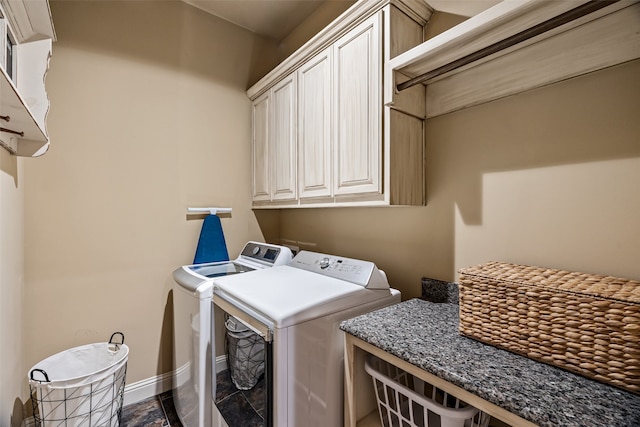 laundry area featuring cabinets and independent washer and dryer