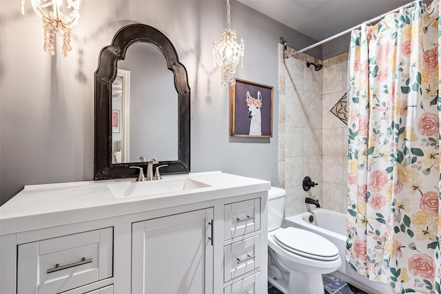 full bathroom with toilet, shower / bath combination with curtain, an inviting chandelier, and vanity