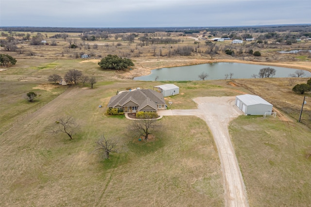 birds eye view of property with a rural view and a water view