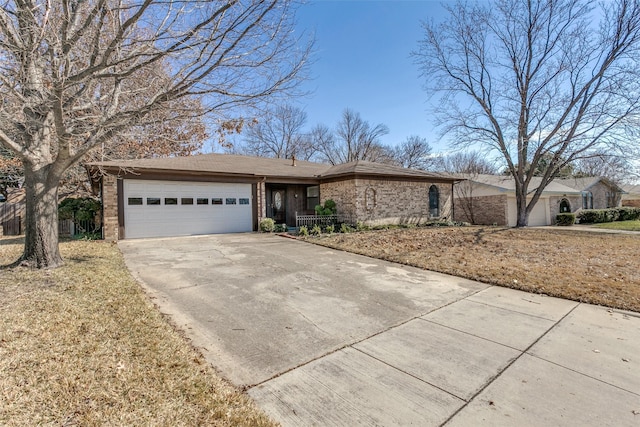 ranch-style home with a front lawn and a garage