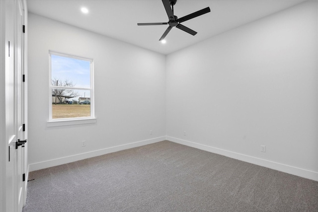 spare room with ceiling fan and carpet flooring