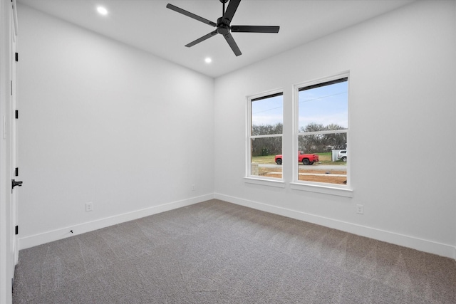 unfurnished room with carpet and ceiling fan