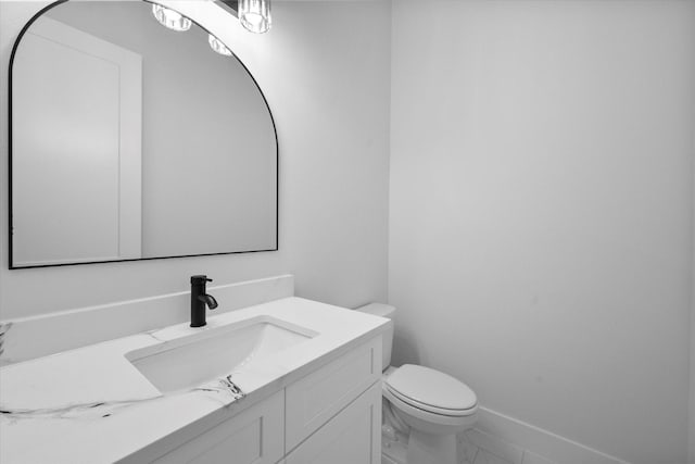 bathroom with toilet and vanity