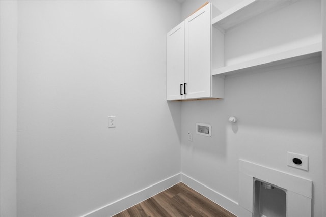 laundry room featuring cabinets, hookup for an electric dryer, dark wood-type flooring, and hookup for a washing machine