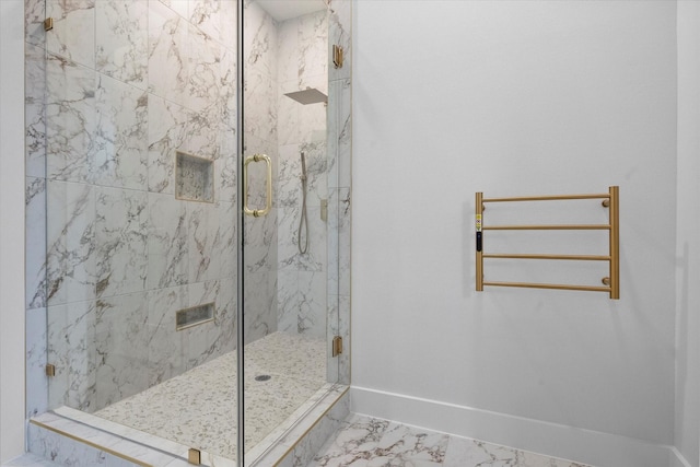 bathroom featuring a shower with shower door