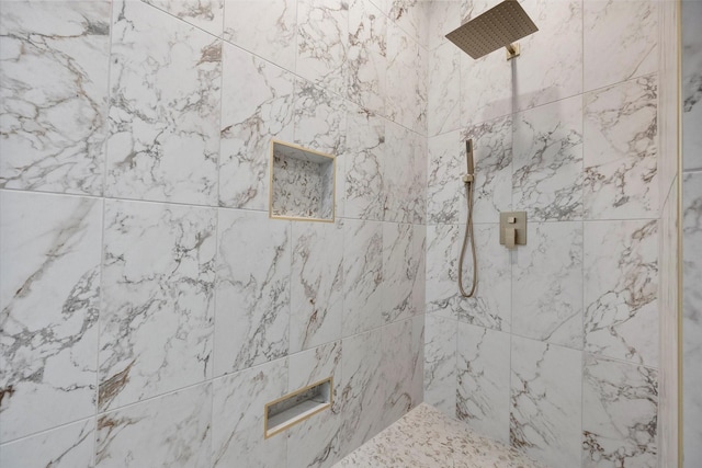 bathroom featuring tiled shower