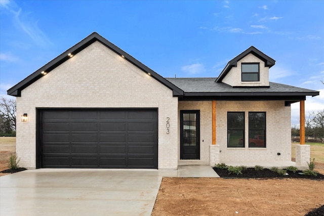 view of front of property featuring covered porch and a garage