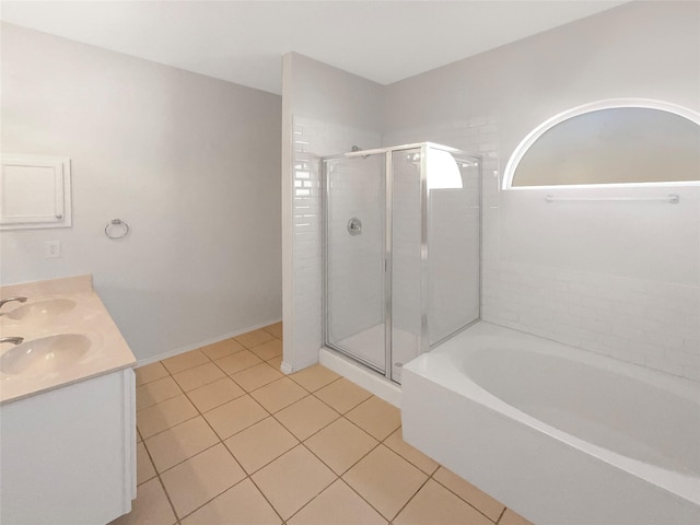 bathroom with tile patterned floors, vanity, and independent shower and bath